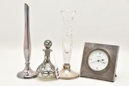 FOUR ITEMS OF SILVER, to include a square form 'R.J.Carr' mantle clock, engraved 'P&O's Millenium