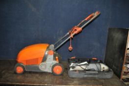 A FLYMO LAWNRAKER COMPACT 3400, a Minitrim ST and a Challenge Xtreme 9in angle grinder (all PAT pass