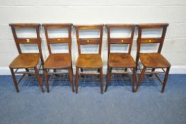 A SET OF FIVE ELM CHAPEL CHAIRS, with a bible tray to the backs, raised on turned legs, united by