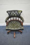 A 20TH CENTURY SWIVEL OFFICE CHAIR, with green buttoned leather upholstery, width 64cm x depth