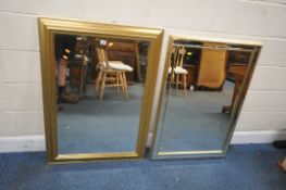 A MODERN GILT WOOD RECTANGULAR BEVELLED EDGE WALL MIRROR, 108cm x 77cm, along with another