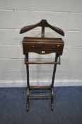 A REPRODUCTION GENTLEMAN'S VALET STAND, with a removable hanger, cuff link tray, two drawers, and