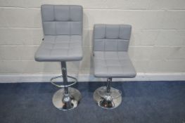 A PAIR OF MILLHOUSE BAR STOOLS, with light grey upholstery, width 43cm x depth 52cm x maximum height