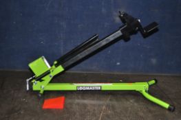 A LOGMASTER MANUAL LOG SPLITTER with blade guard, maximum log length 19in (48cm)