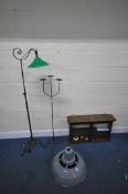 A WROUGHT IRON TELESCOPIC STANDARD LAMP, with a green shade, maximum height 157cm, a three branch