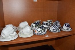 A GROUP OF UNFINISHED ROYAL CROWN DERBY TEAWARE, comprising sixteen tea cups and saucers, with