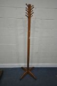 A STAINED HARDWOOD COAT / HAT STAND, with ten hooks, raised on four splayed legs, height 178cm,