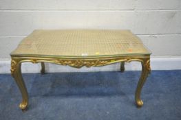 A GILT WOOD RECTANGULAR COFFEE TABLE, with cane surface and glass protector, width 88cm x depth 55cm