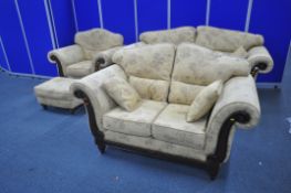 A GOLD AND PATTERNED UPHOLSTERED FOUR PIECE LOUNGE SUITE, comprising a large two seater sofa, with
