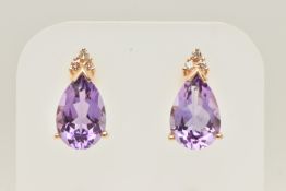 A PAIR OF 14CT GOLD AMETHYST AND DIAMOND STUD EARRINGS, each earring set with a pear cut amethyst