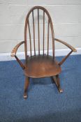 LUCIAN ERCOLANI, AN ERCOL MID-CENTURY ELM QUAKER BACK ROCKING CHAIR, with open armrests, width