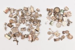 A BAG OF ASSORTED SILVER AND WHITE METAL CHARMS, to include three hallmarked silver charms to