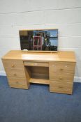ALSTONS FURNITURE, A LATE 20TH CENTURY DRESSING TABLE, with seven assorted drawers, raised on