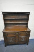 A 20TH CENTURY OAK DRESSER, the three tier plate rack with an arrangement of hooks, atop a base with