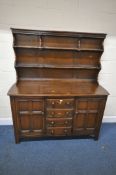 LUCIAN ERCOLANI, AN ERCOL MID-CENTURY ELM OLD COLONIAL DRESSER, the three tier plate rack atop a