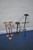 FIVE WIG STANDS, one wrought iron stand with an arm, height 87cm, a wooden stand, and a set of three