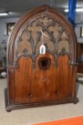 A BUSH 'AC3' CATHEDRAL RADIO CASE in a walnut veneer, moulded imitation wood fret, fitted with a