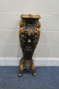 A REPRODUCTION FRENCH STYLE EBONISED AND GILDED BAROQUE STAND, with scrolled