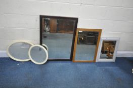 FIVE WALL MIRRORS, varying in shape, size, style, material, etc, and a standard lamp, condition