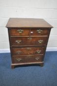 AN 18TH CENTURY OAK CHEST ON CHEST, each section fitted with two drawers, brass handles, raised on