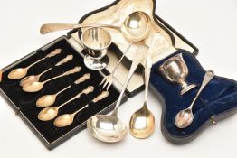 AN ASSORTMENT OF SILVER ITEMS, to include a cased silver egg cup and spoon set, a cased set of six