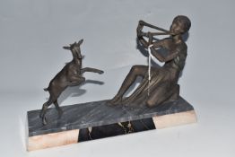 A FRENCH ART DECO STATUE mounted on a marble base, depicting a spelter girl playing panpipes to a