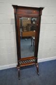 A REPRODUCTION BEVELLED EDGE CHEVAL MIRROR, with twin ebonised pillars, flanking the swing mirror,