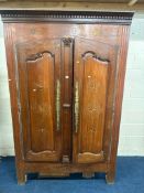 AN EARLY 20TH CENTURY MAHOGANY WARDROBE, with double doors, brass studs, geometric inlays, width