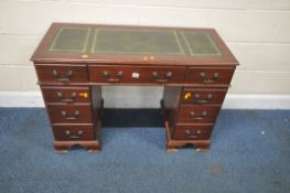 A REPRODUCTION MAHOGANY TWIN PEDESTAL DESK, with green leatherette writing surface, seven assorted