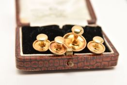 A CASED SET OF FOUR EARLY 20TH CENTURY 18CT GOLD DRESS STUDS, each of a polished form, hallmarked