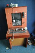 A MID 20th CENTURY TELEPHONE EXCHANGE with detachable handset, dialing ring with a Rottingdean paper