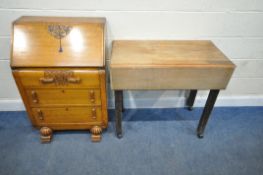 AN EARLY 20TH CENTURY OAK BUREAU, the fall front door enclosing a fitted interior, over three
