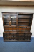 LUCIAN ERCOLANI, AN ERCOL MID-CENTURY ELM WALL UNIT, fitted with double glazed doors, two fall front
