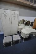 A SELECTION OF CREAM FRENCH BEDROOM FURNITURE, to include a wardrobe, the double doors enclosing a