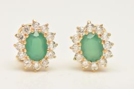 A BOXED PAIR OF YELLOW METAL GEM SET CLUSTER EARRINGS, each earring of an oval form, set with a
