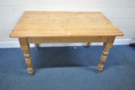 A MODERN PINE RECTANGULAR TABLE, with a single drawer to one end, raised on block and turned legs,