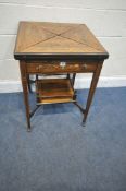 AN EDWARDIAN ROSEWOOD ENVELOPE CARD TABLE, parquetry inlay, the rotating top with a green baize