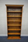 A MODERN PINE OPEN BOOKCASE, width 99cm x depth 30cm x height 219cm, condition report: marks,
