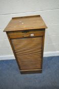 DISTINCTIVE OFFICE FURNITURE LTD, AN EARLY 20TH CENTURY OAK TAMBOUR FRONT CABINET, with nine