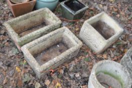 THREE CONCRETE PLANTERS, comprising a pair of rectangular planters with rope top edges, stamped