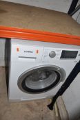A SIEMENS IQ500 WASHER DRYER, with 7kg and 4kg capacity, width 60cm, depth 60cm, height 85cm (PAT