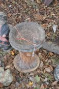 A CONCRETE BIRDBATH, in the form of a tree stump with squirrels around trunk, a bowl and a small