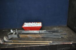 A SELECTION OF GOLF CLUBS AND A TRAY OF GOLF BALLS, including a Ted Manton Autograph, another