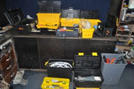 EIGHT TOOLBOXES AND A BIN CONTAINING TOOLS AND HARDWARE, including saws, hammers, plumbing tools and