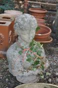 A CONCRETE BUST OF A ROMAN LADY, height 70cm, Condition Report: ivy and minor weathering
