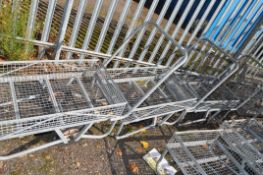 THREE GALVANISED TROLLEYS, with mesh beds and sides, two wheels and a handle, bed width 53cm, length