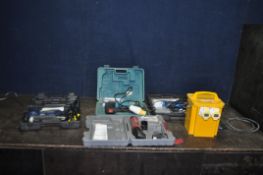A DRAPER MULTISAW in case with some accessories, an Arrow electric stapler in case, a Fortis 110v
