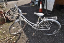 A RALEIGH CAPRISE LADIES BICYCLE, with three speed Sturmey Archer gears, 21in frame, front basket