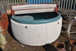 A HOTSPOT HOT TUB, with lid, chemical and workings inside, 180cm in diameter 100cm high (