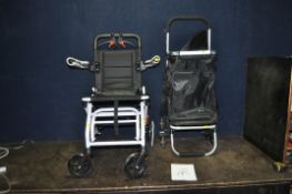 A MANUAL FOLDING WHEELCHAIR (still in packaging) and a triple wheeled shopping trolley for stair